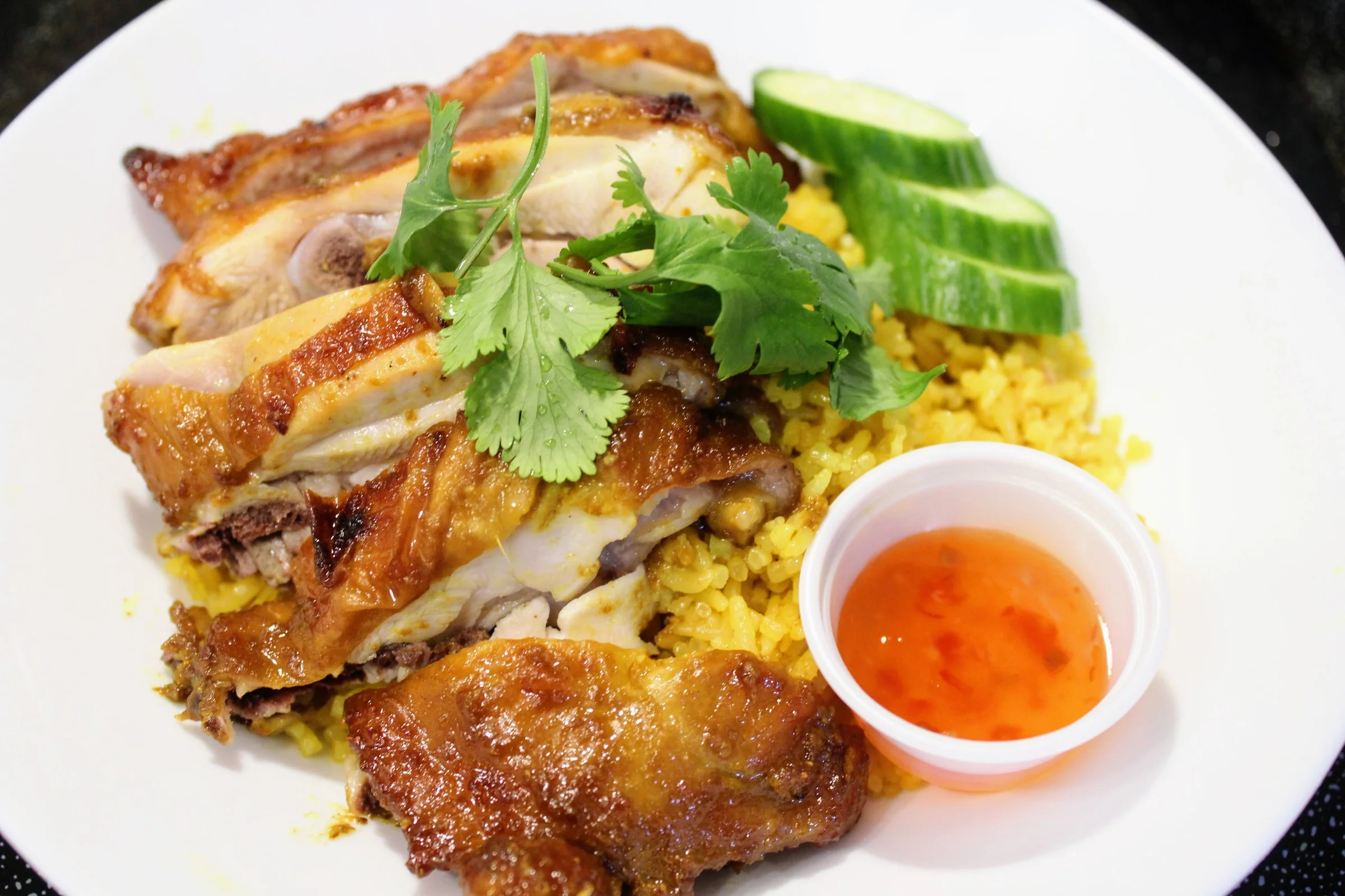 Thai grilled chicken over yellow rice